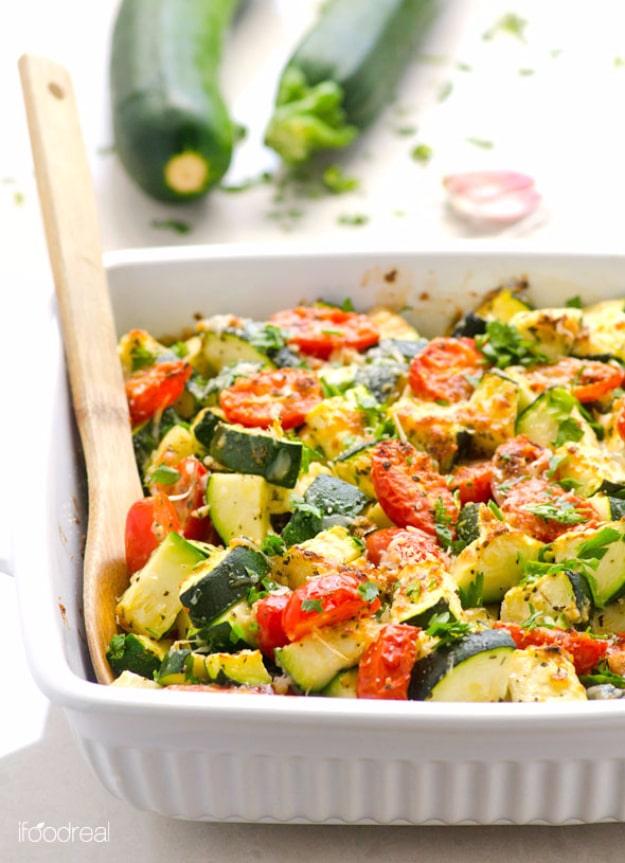 Garlic parmesan zucchini and tomato bake with sliced squash, cherry tomatoes and melted cheese fresh from the oven