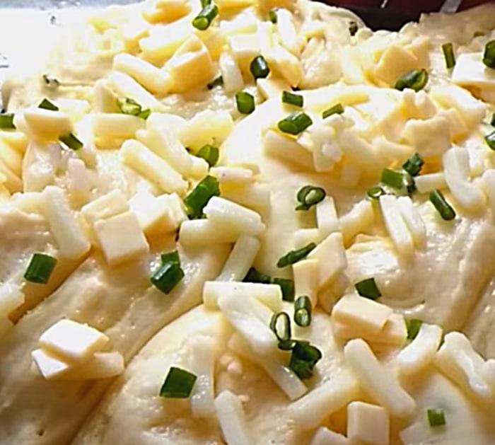 Homemade bread loaf with garlic and scallions