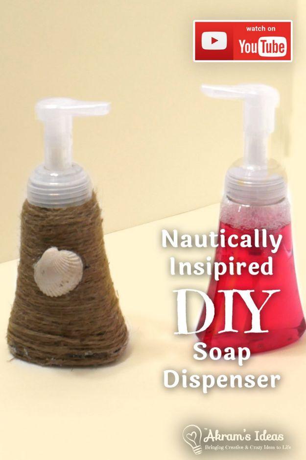 Two foaming soap dispensers, one wrapped in jute twine with a shell glued to the front, one clear with pink soap
