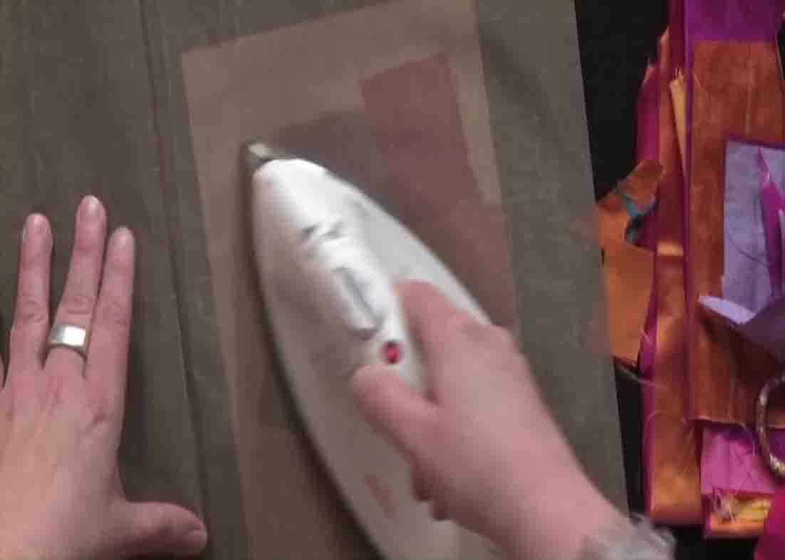 Ironing the Teflon over the muslin fabric