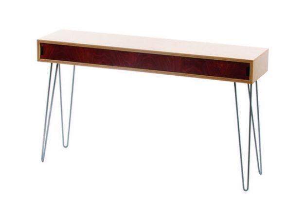 Narrow pale wood sofa table with a dark red drawer front running its full length, standing on thin steel hairpin legs