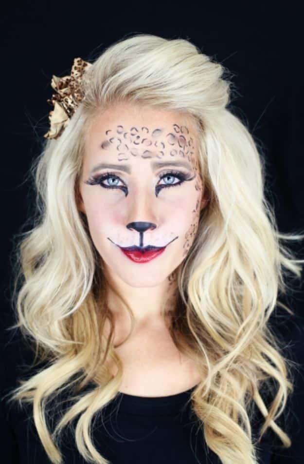 Easy cat Halloween makeup with a black painted nose, drawn whiskers, soft eye shading and white highlights