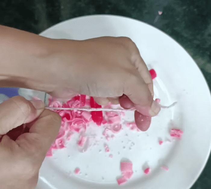 Remove the candle wax from the wick