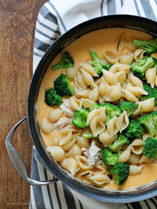 Chicken and broccoli shells and cheese in a pot with homemade cheddar sauce coating pasta shells and florets