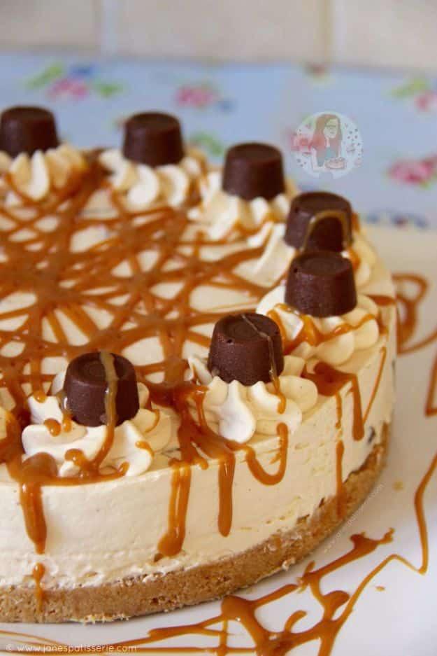 No bake caramel Rolo cheesecake topped with whole Rolos and caramel drizzle over a digestive biscuit base