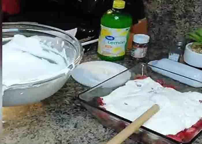Assembling the strawberry punch bowl cake