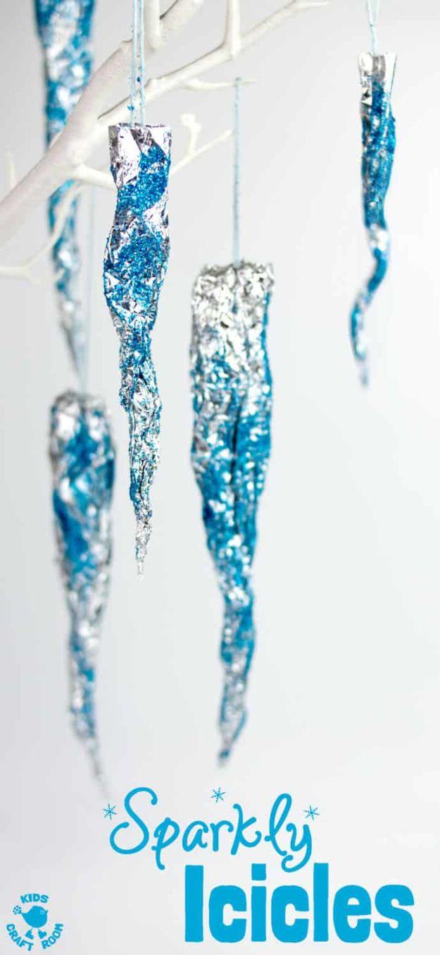 Pin graphic titled Sparkly Icicles showing four twisted foil icicles coated in blue glitter hanging on threads