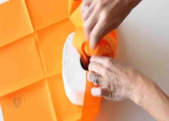 Wrapping the toilet paper with fat quarter fabric