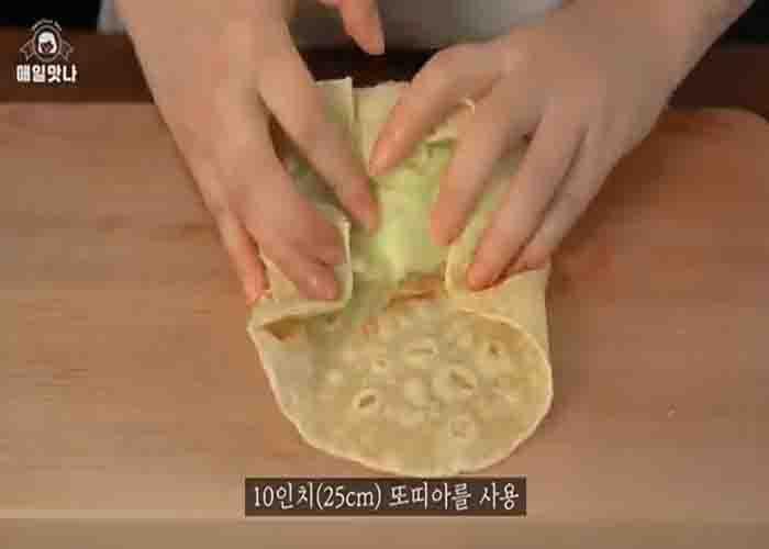 Assembling the cheeseburger burrito