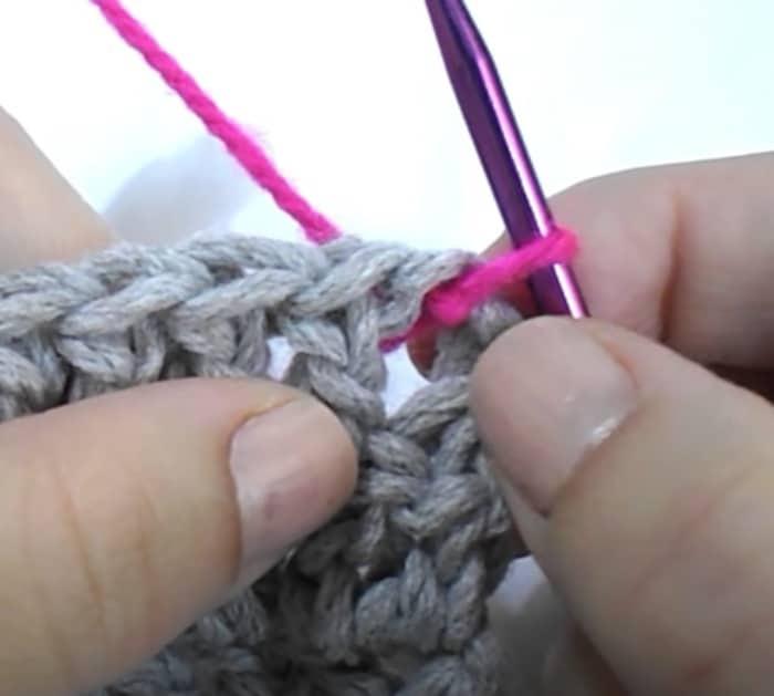 Make a border for crochet work with pom poms