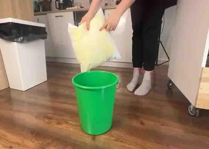 Soaking the pillows in a bucket of water