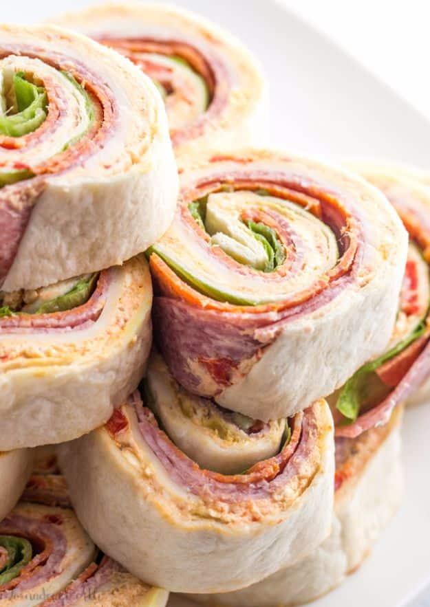 Italian pinwheels sliced into spirals with salami, pepperoni, provolone and peppers on a party platter