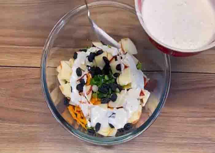 Adding the dressing over the broccoli salad
