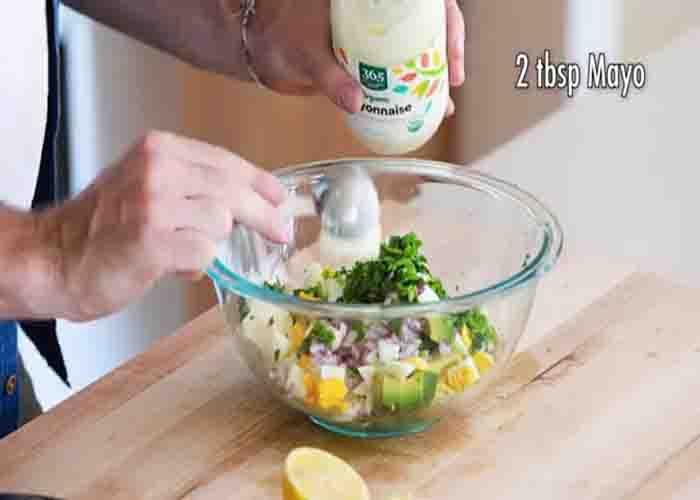 Mixing all the ingredients for the avocado egg salad