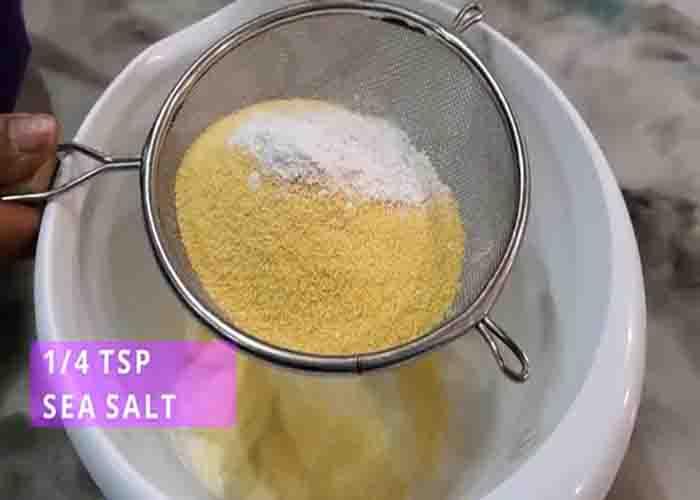 Sifting the flour and cornmeal for the cornbread recipe