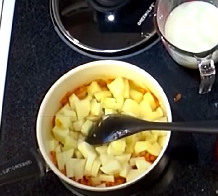 Saute Onions, Carrots, And Potatoes For 100 Year Old Potato Soup