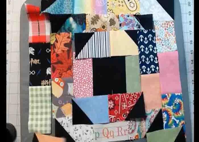 Assembling the scrappy folded corners quilt block