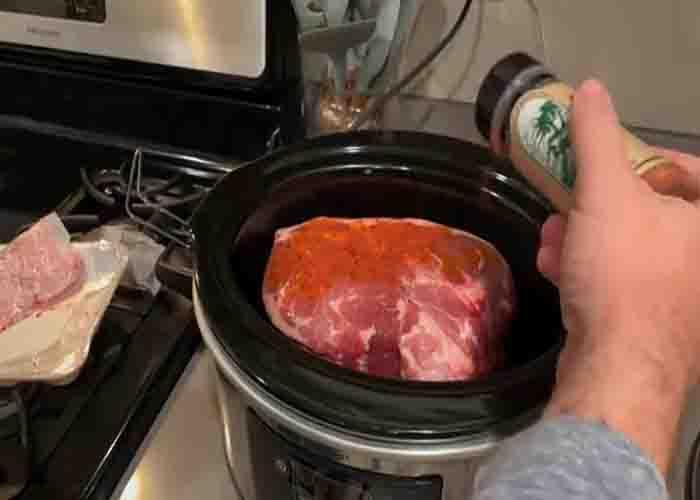 Seasoning the pork liberally with all-purpose rub
