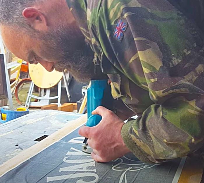 Make a drinks cabinet and sign from recycled pallet boards