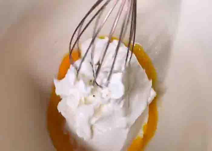 Mixing the ingredients to make the chocolate mousse cake