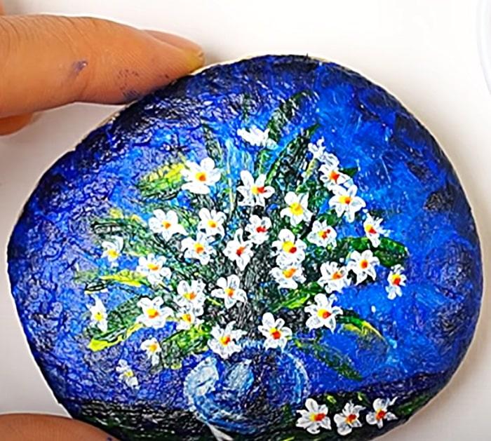 Paint river rocks with acrylic craft paints