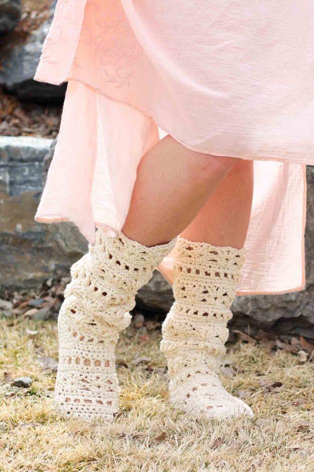 Coachella boots, cream lacy crochet boots worn under a pale pink skirt, built on a pair of flip flop soles