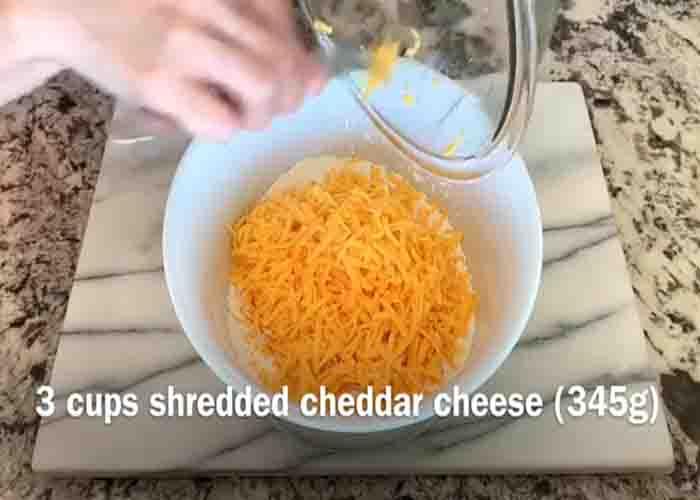 Combining the ingredients for the cheesy and flaky muffins