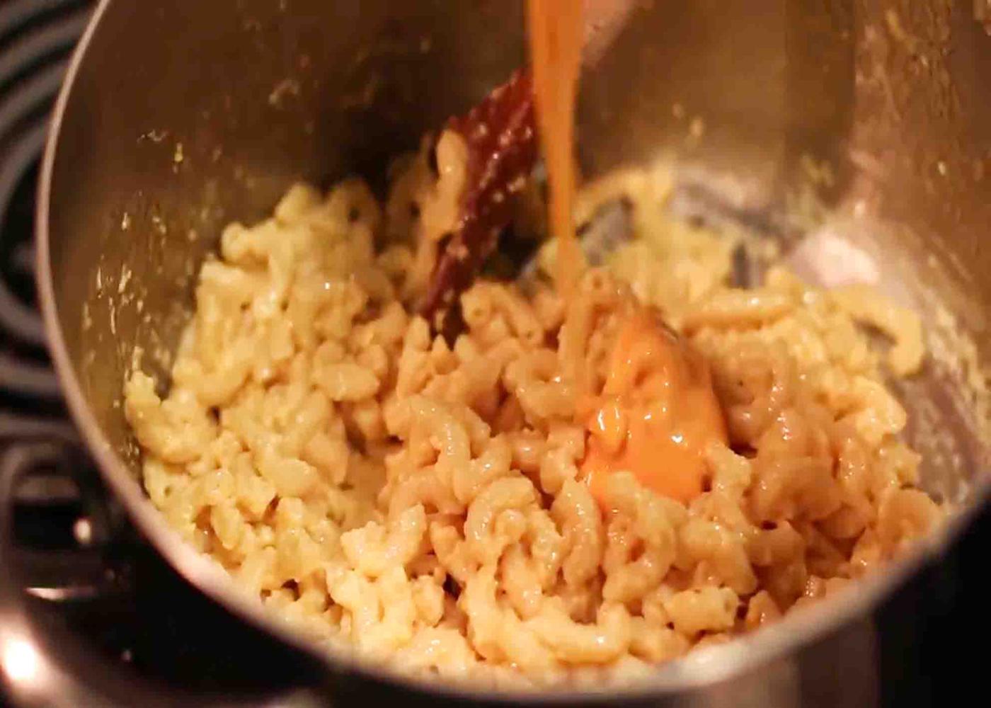 Adding velveeta to the mac and cheese for extra cheesiness