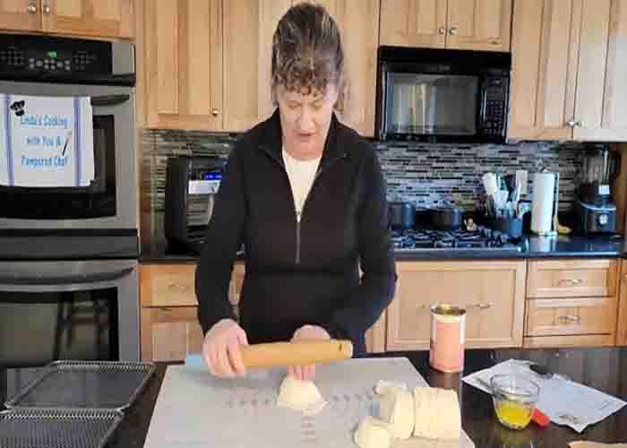 Rolling the biscuit to make mini pie bombs