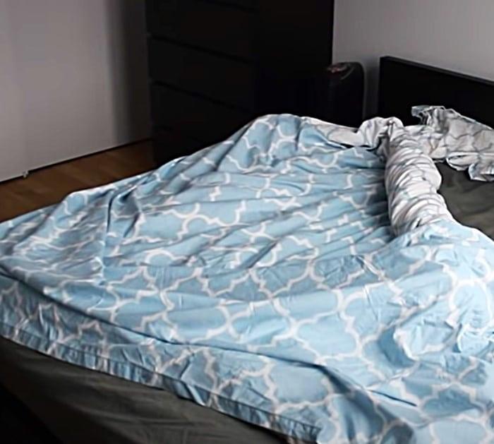 Use a roll up burrito method to put a duvet cover onto a comforter