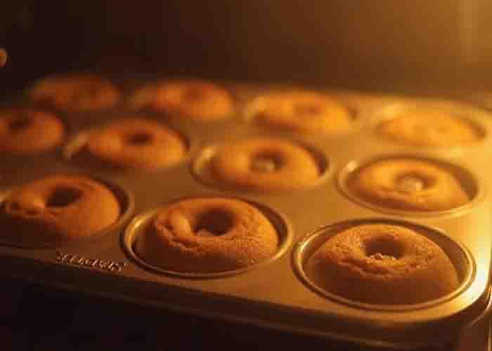 Baking the apple cider donuts