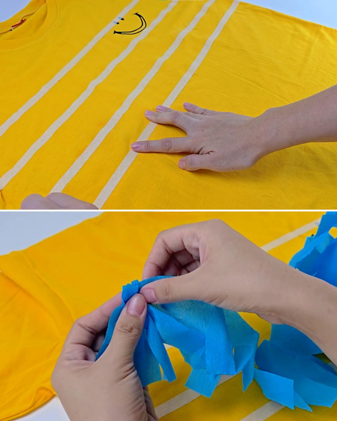 DIY Crafts - a hand pressing masking tape stripes across a yellow t-shirt, then scrunching a crepe fringe strip over it