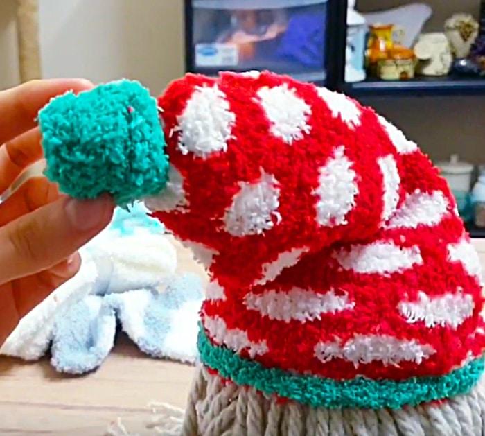 Learn to make a DIY Sock Gnome for Christmas out of rice and Dollar Tree Items