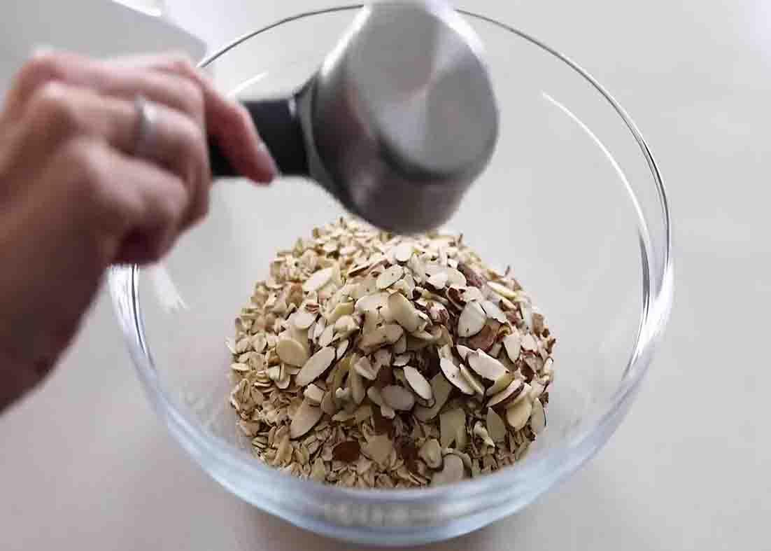 Combining all the ingredients for the berry baked oatmeal recipe
