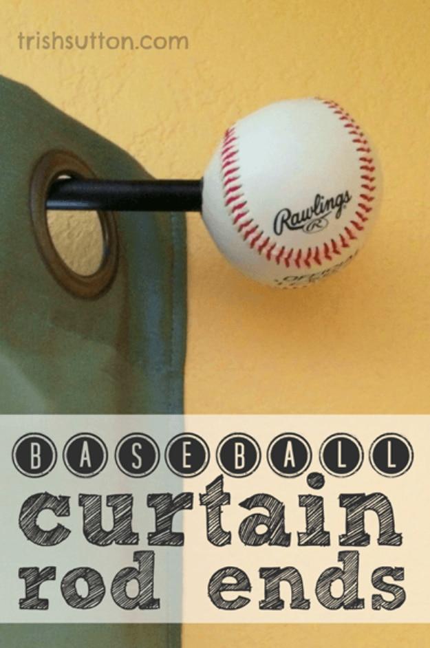 Baseball pushed onto the end of a black curtain rod as a finial, against a yellow wall with a green curtain