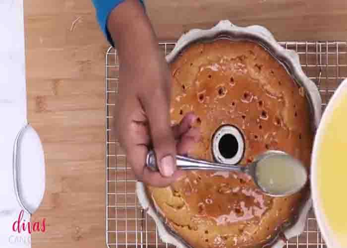 Pouring the syrup over the Kentucky butter cake