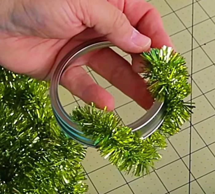 Learn to make DIY cheap Dollar Tree Mason Jar Lid Wreath Ornaments