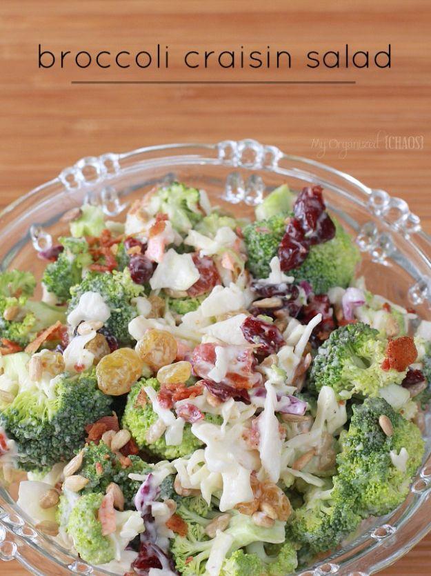 Broccoli craisin salad in a glass bowl with chopped broccoli, dried cranberries, raisins and creamy dressing
