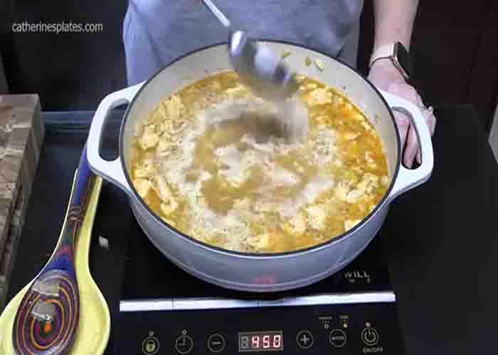 Stirring the chicken and rice together