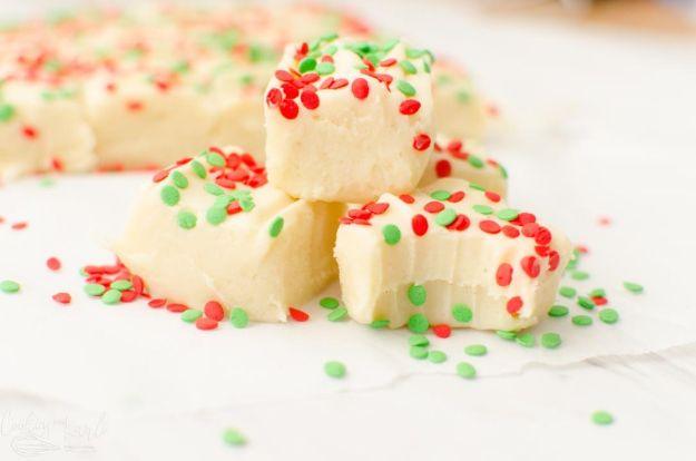 Sugar cookie fudge cut into squares with rainbow sprinkles on top, an easy no bake dessert recipe, an easy no bake dessert