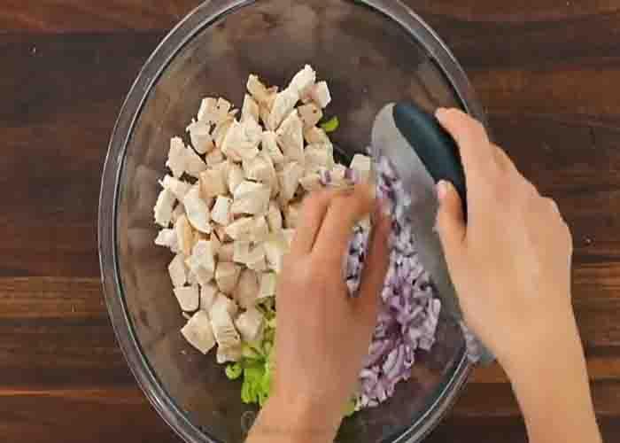 Chopping the ingredients for the chicken salad recipe