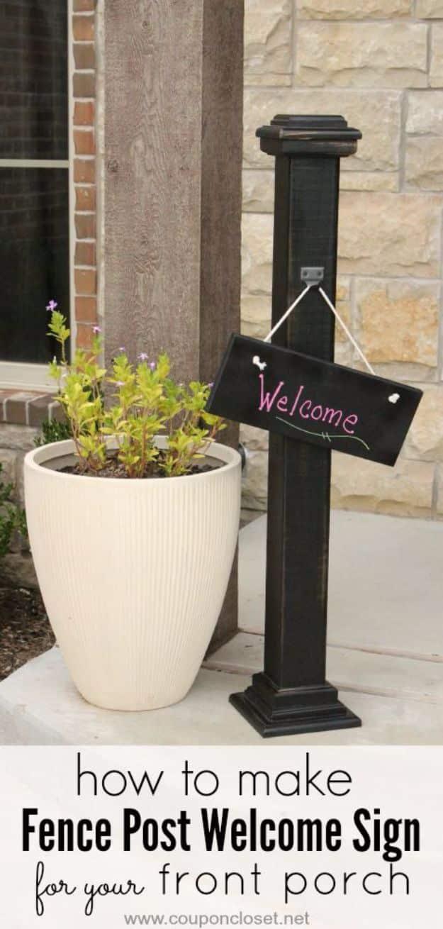 Fence post welcome sign, a tall black painted post on a porch with a small chalkboard Welcome sign hanging from a hook