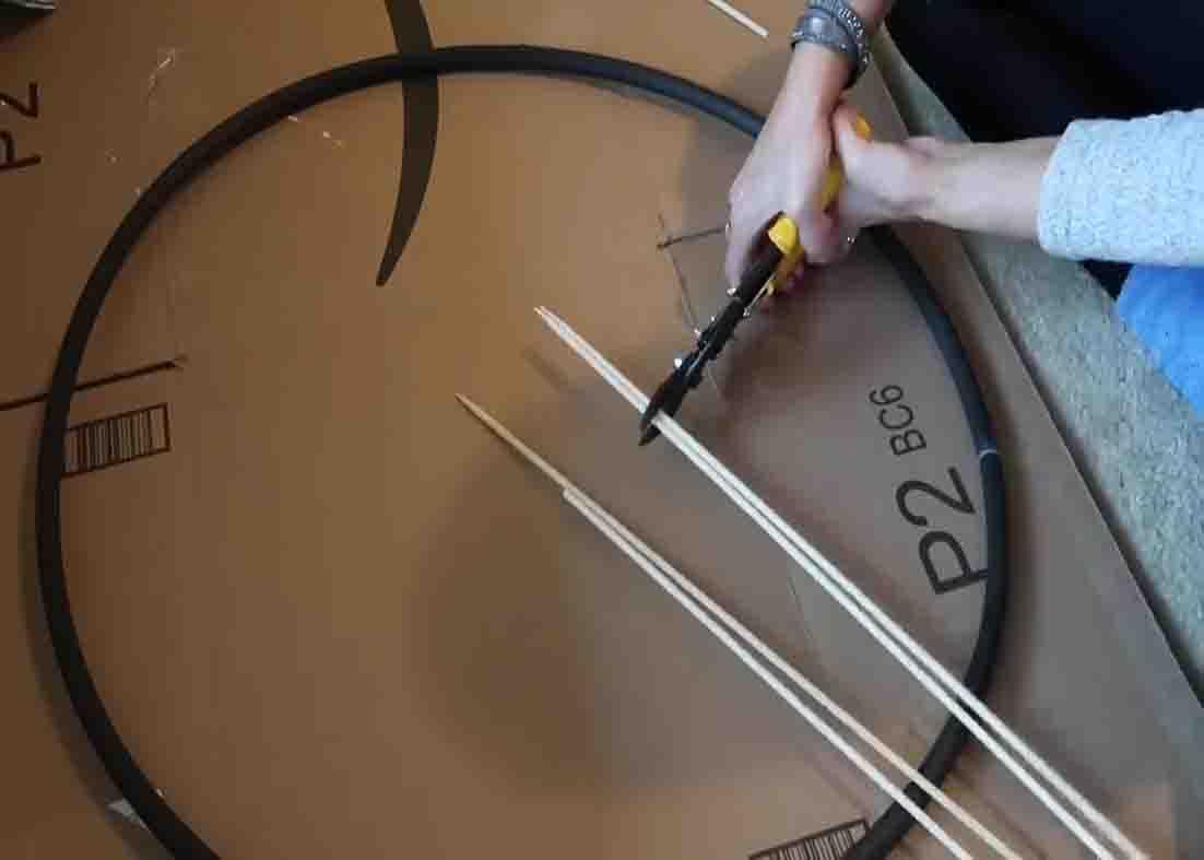 Cutting the skewers for the DIY farmhouse wagon wheel