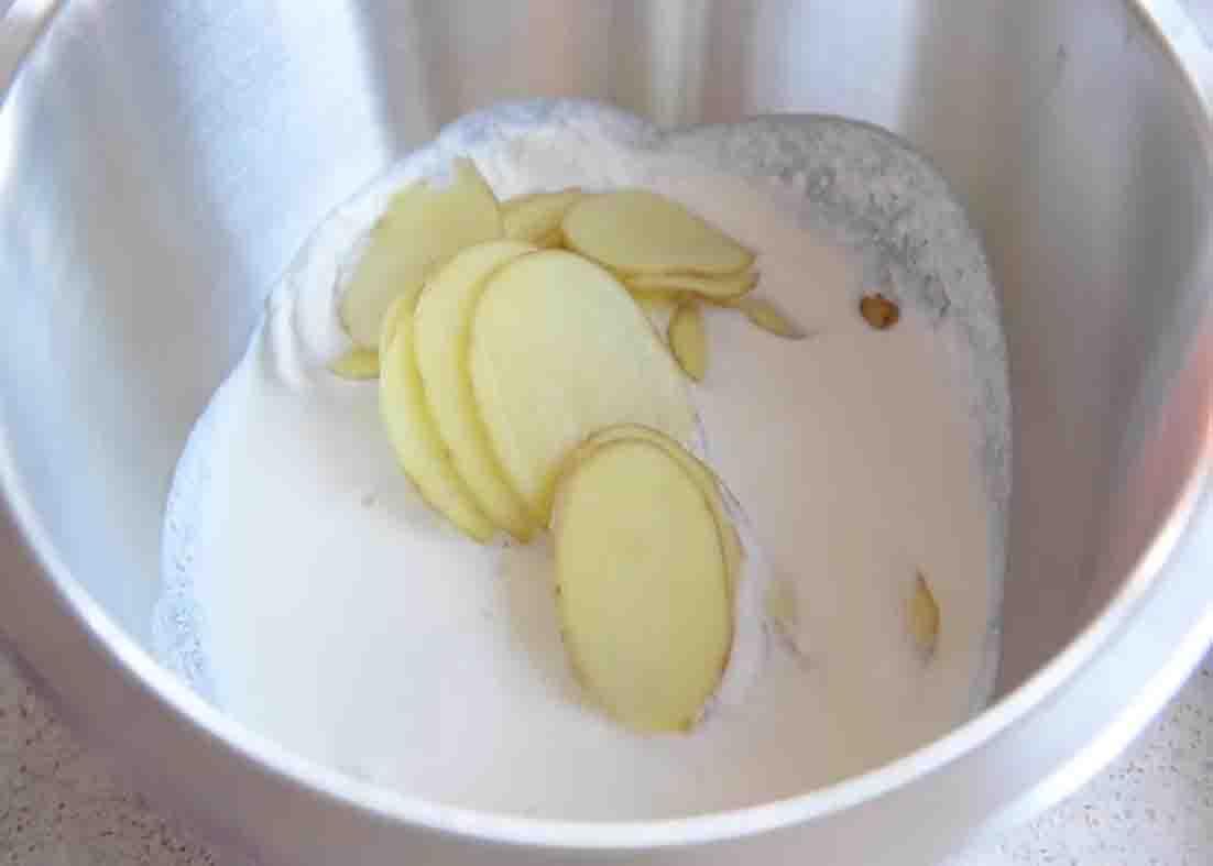 Combining all the ingredients for potato gratin casserole