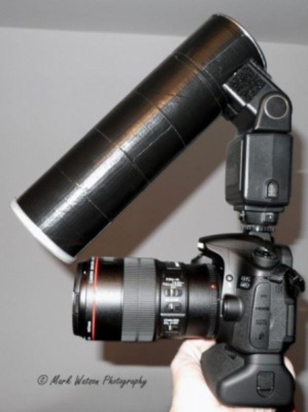 DIY macro diffuser, a matte black cardboard tube fitted over a speedlight on a Canon DSLR with a macro lens