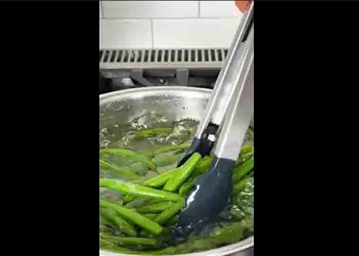 Boiling the green beans for the almondine recipe