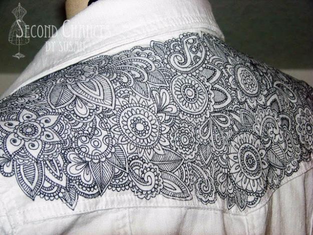 Tattooed denim jacket, a white denim jacket shoulder covered in fine black henna style patterns and mandala designs