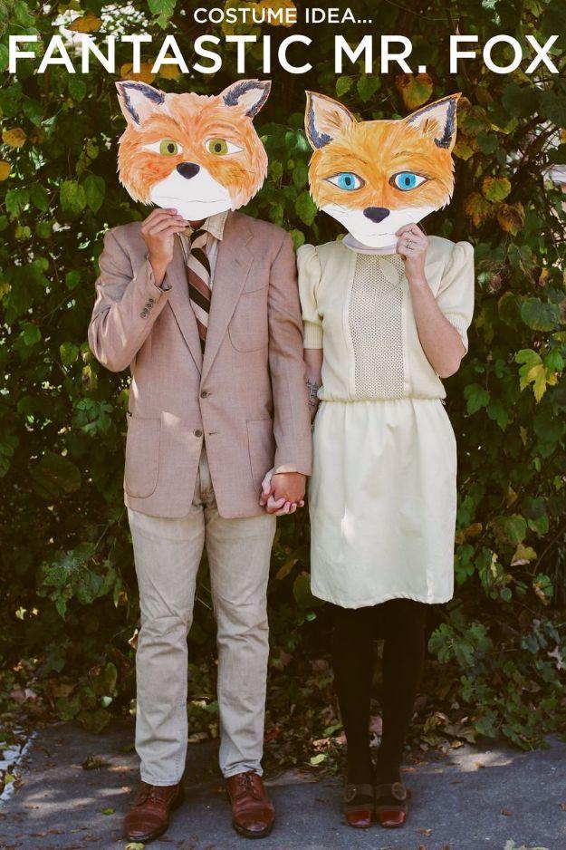 Fantastic Mr. Fox couples costume with painted poster board fox masks, a vintage suit jacket and a cream dress