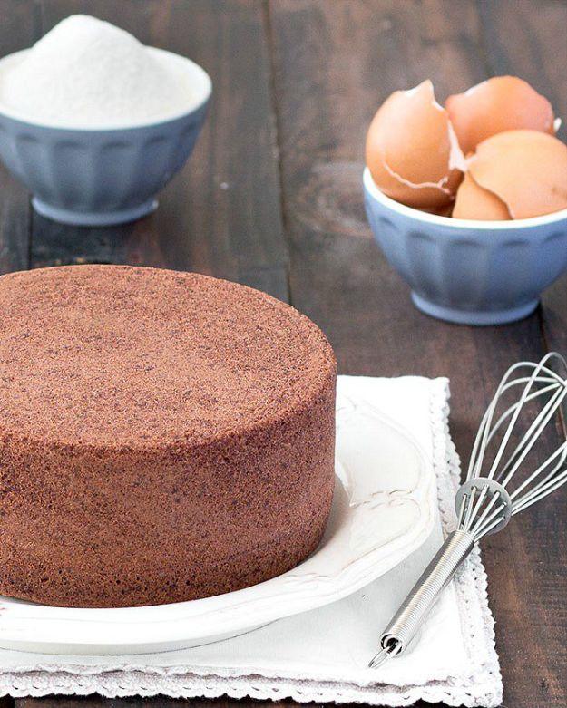 Chocolate Italian sponge cake, a tall four ingredient cocoa sponge cooling slowly in its round baking pan