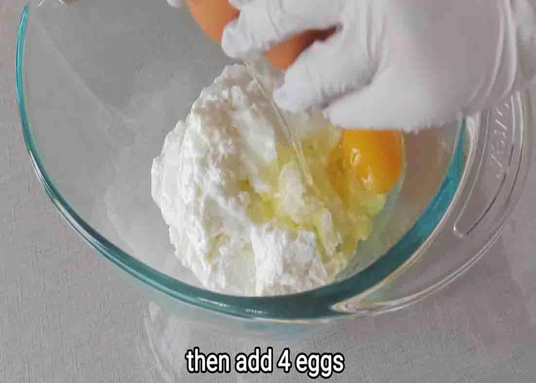 Combining the yogurt cake ingredients in a large bowl